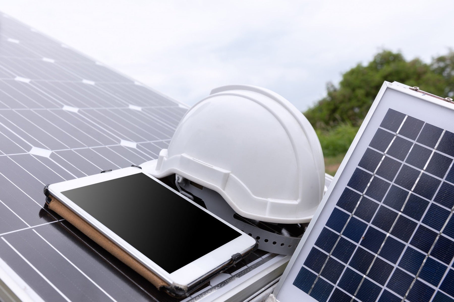 best solar panel system with white hat and a tablet