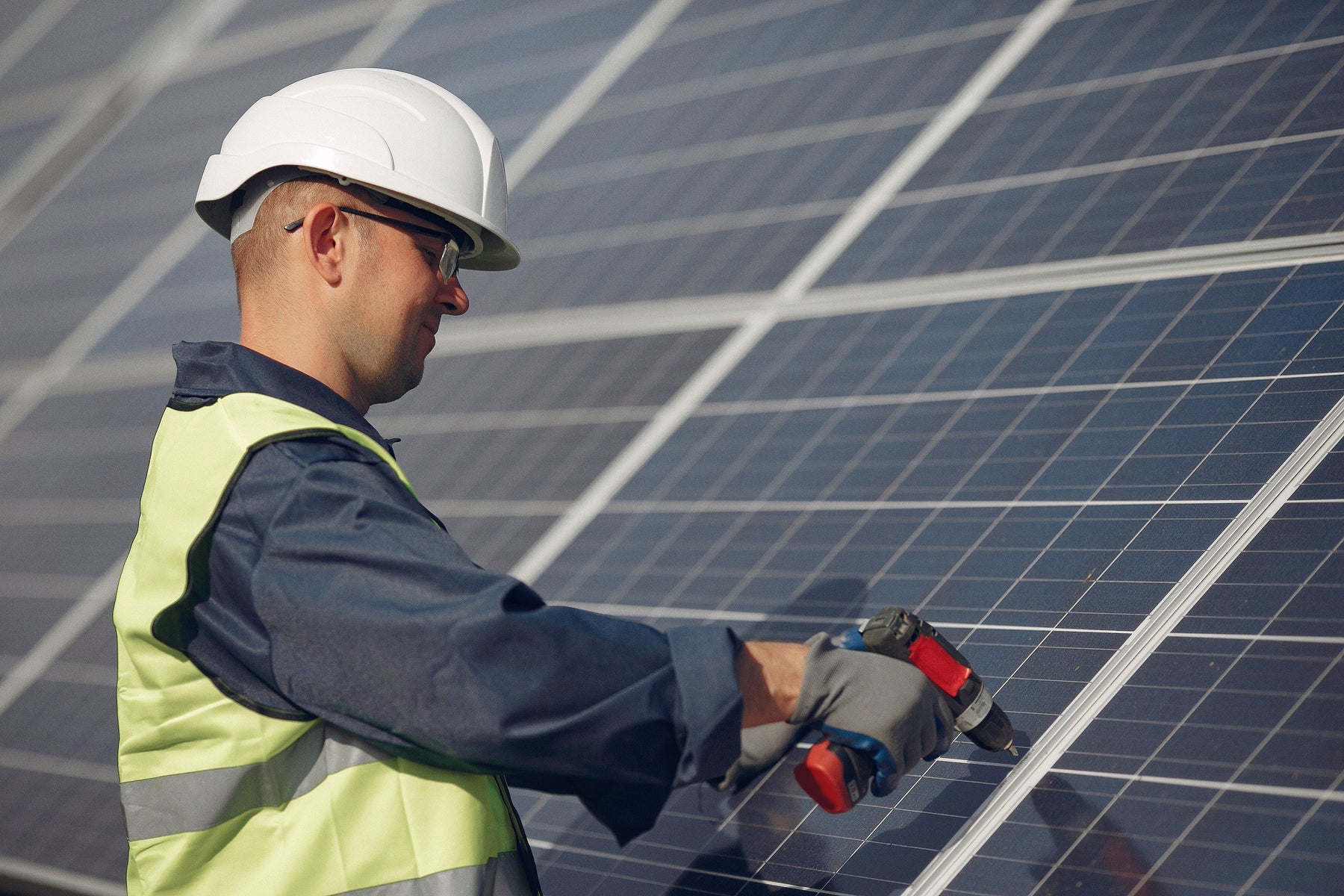a man installing solar panels