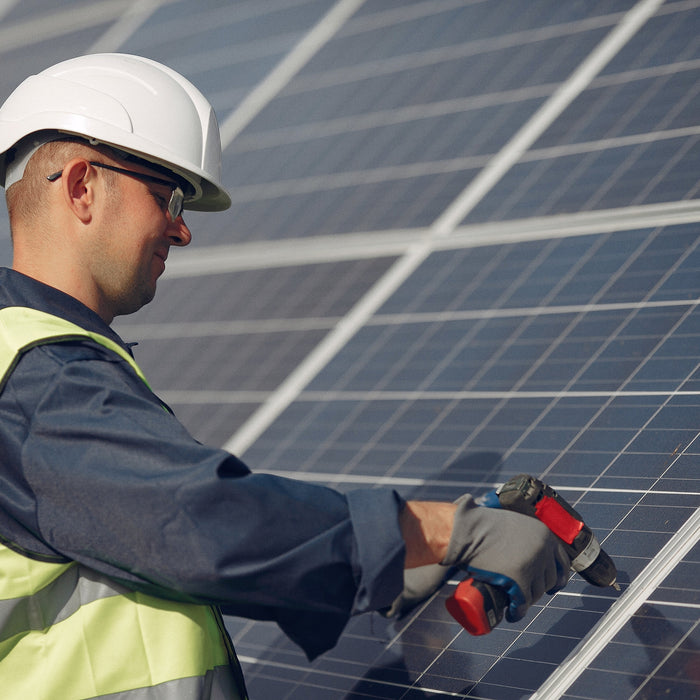 a man installing solar panels