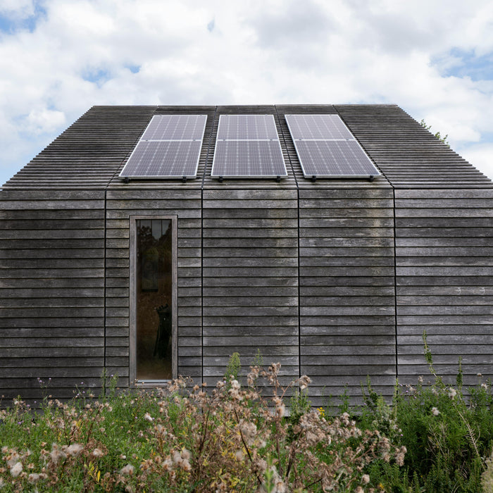 a mini beautiful house with solar panels