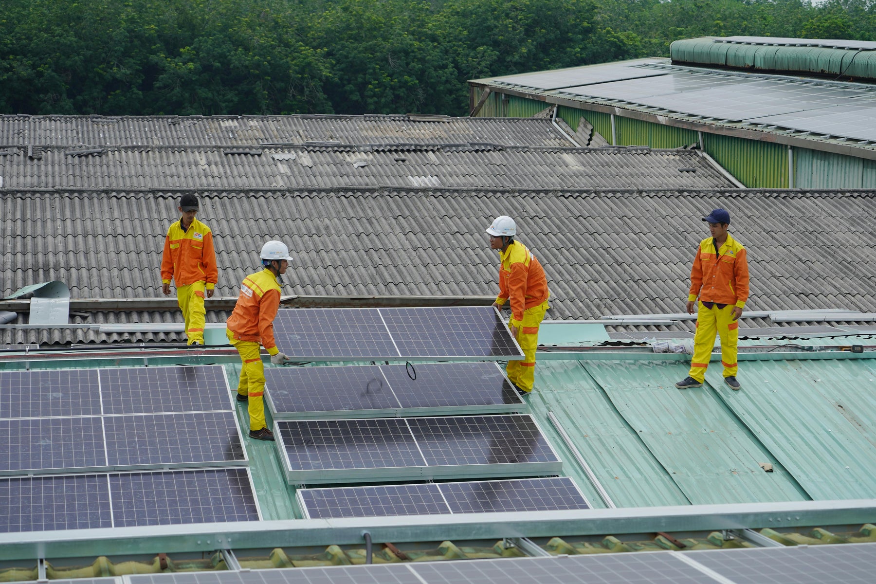 a group of technician installing a solar panels
