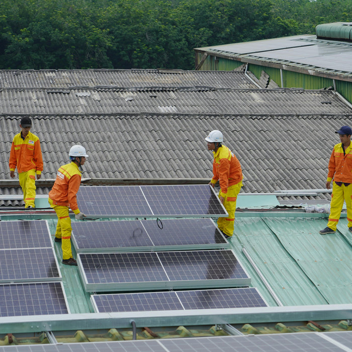 a group of technician installing a solar panels